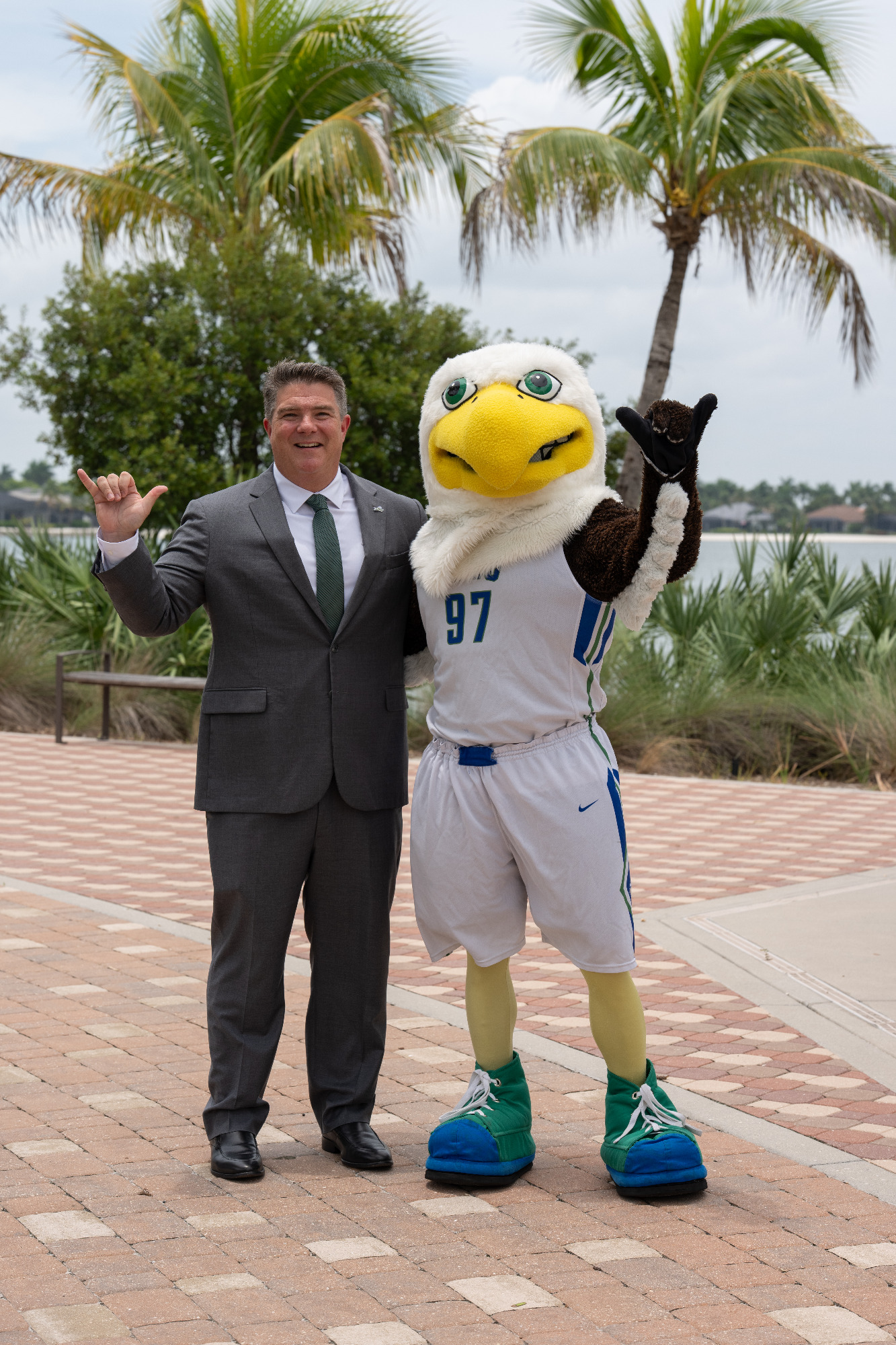 Brian Barrio poses with Azul the Eagle ahead of his introductory press conference at FGCU