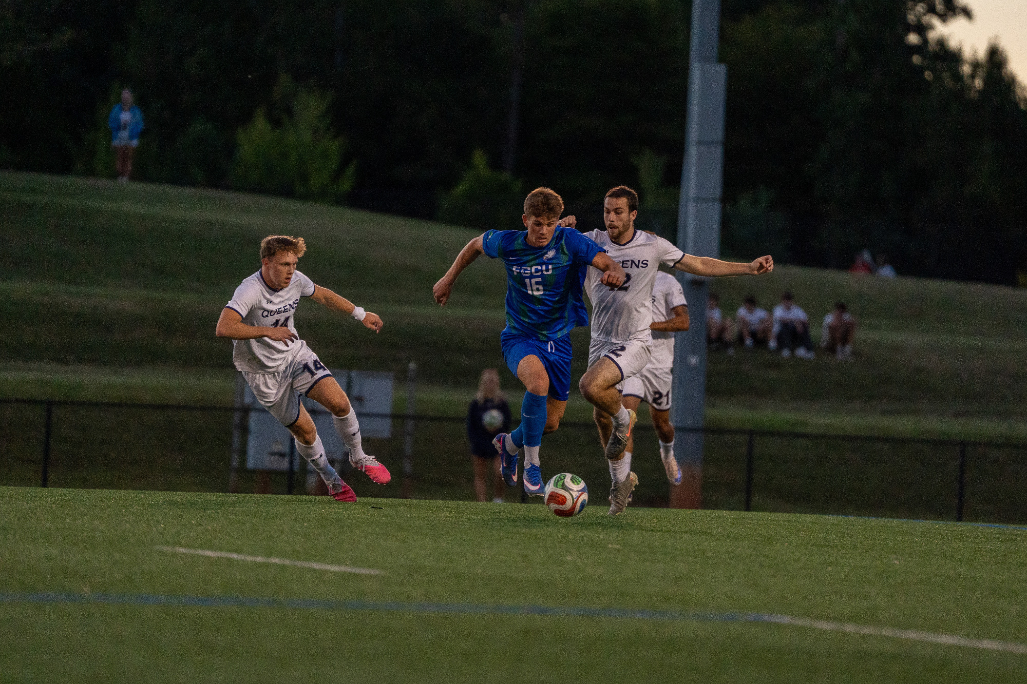 Lucas Barsoe dribbles against Queens // Photo courtesy Queens Athletics