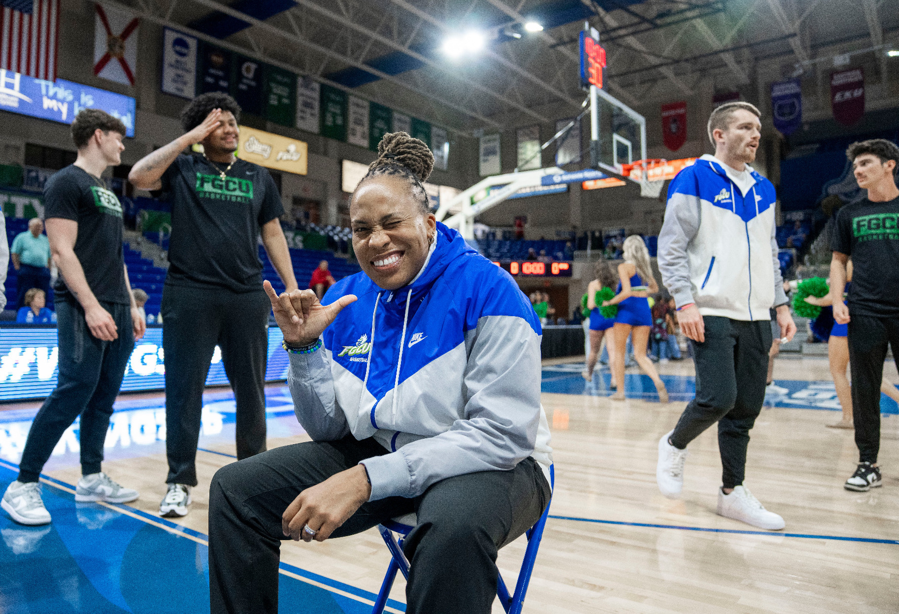 Head coach Raina Harmon poses for a photo before a game