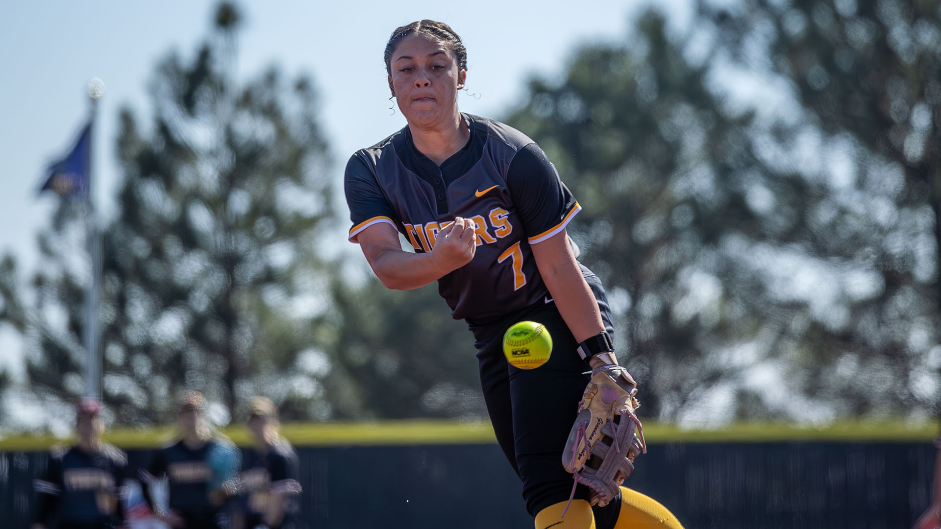 Solana Carpenter pitches a softball during her warmup