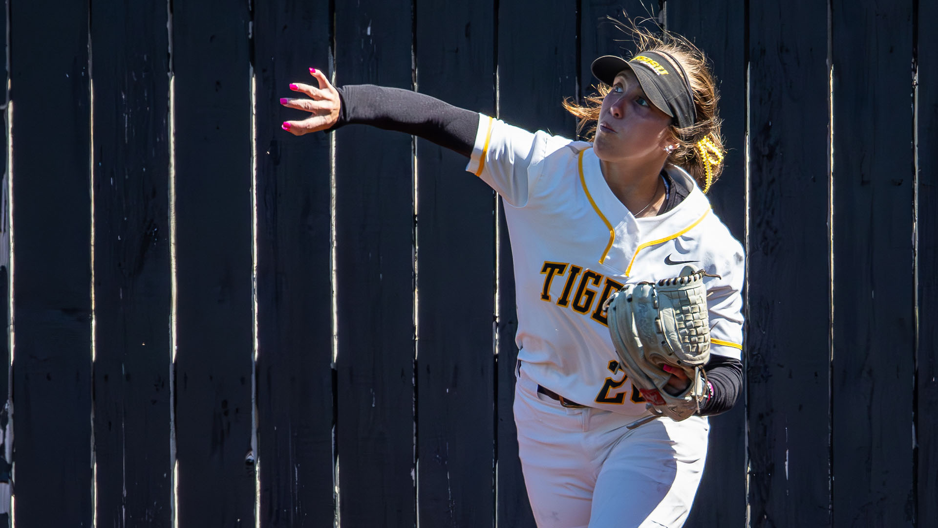 Peyton Shepard throws a ball back to the infield during a game with Washburn