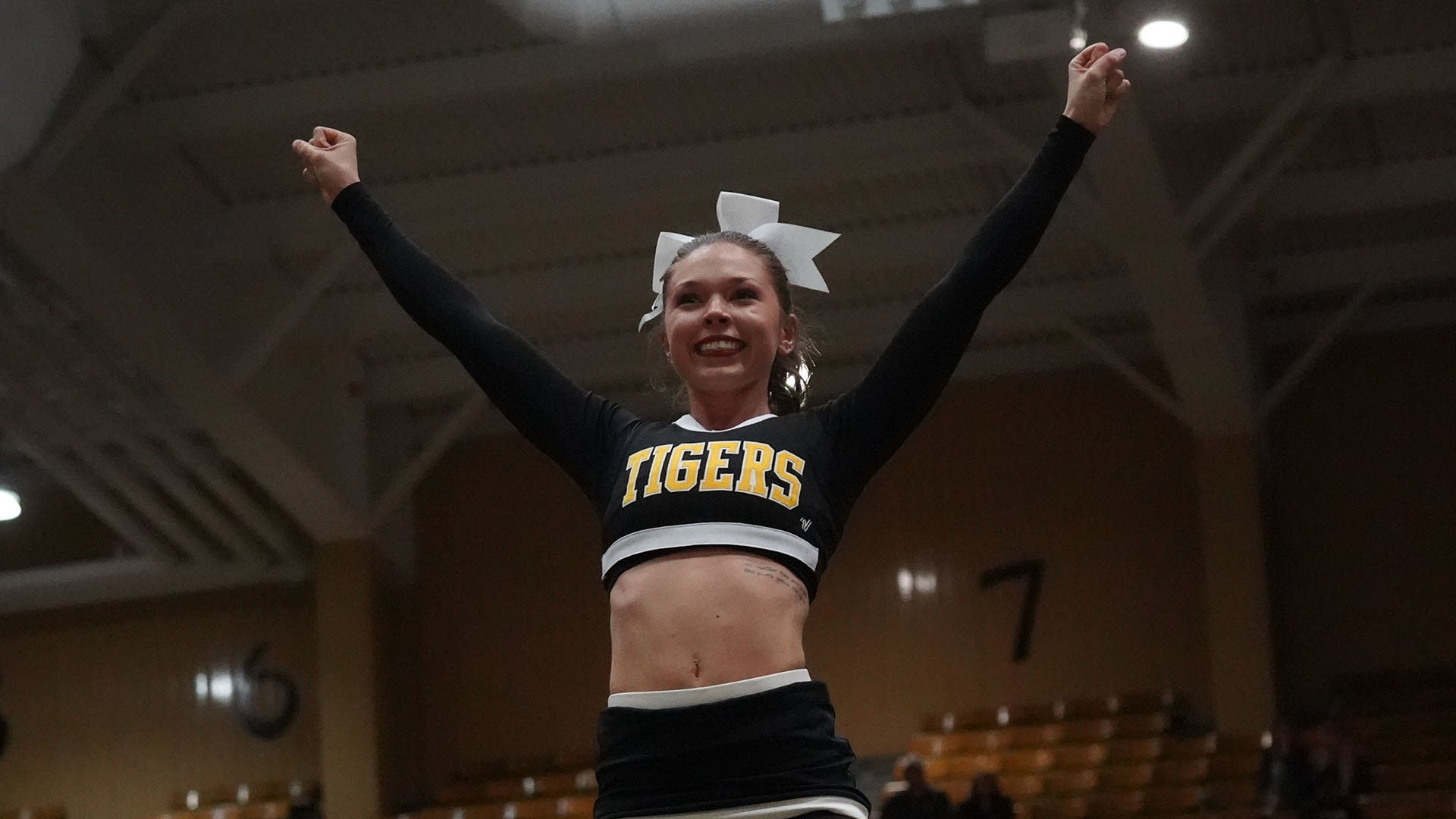 Cheerleader in action at an FHSU basketball game