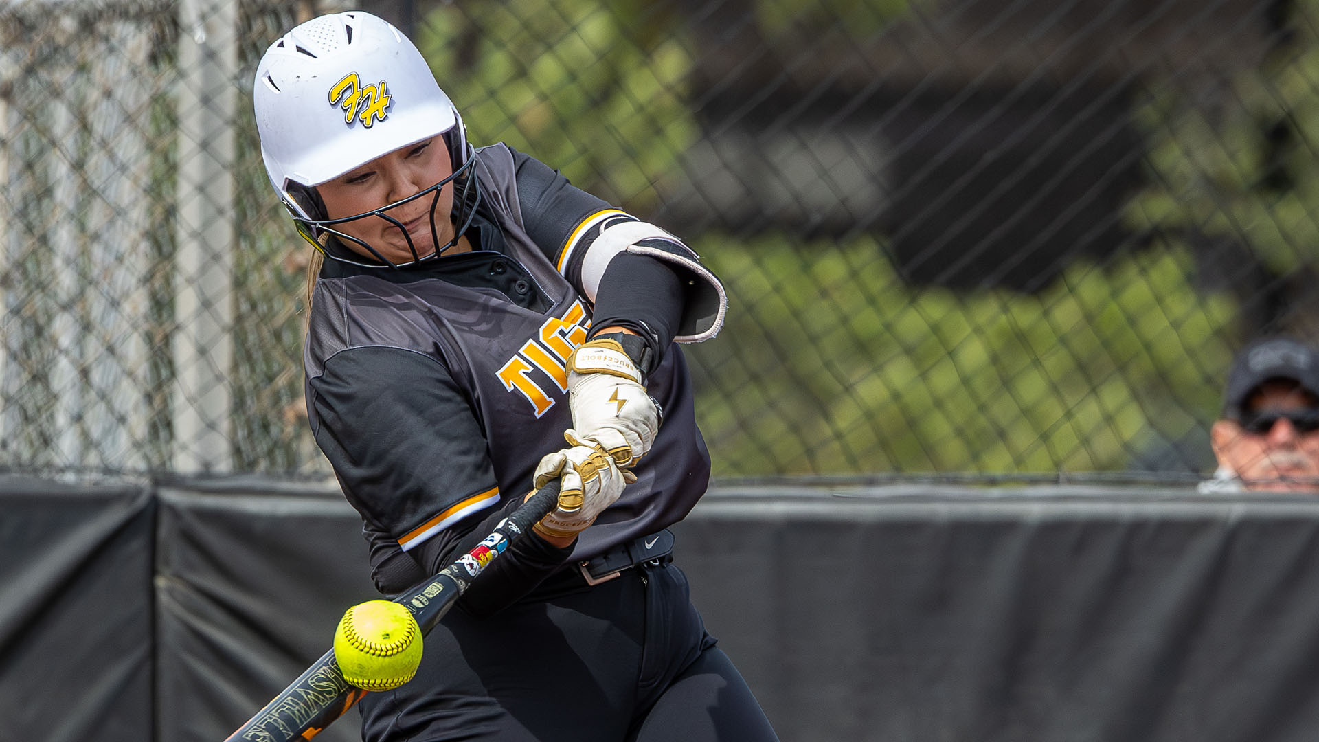 Abbey Duarte hits the ball during a softball game in Hays