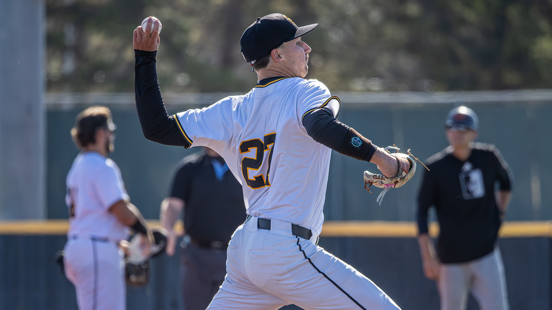 Tucker Russell pitches a ball during a baseball game with Pittsburg State