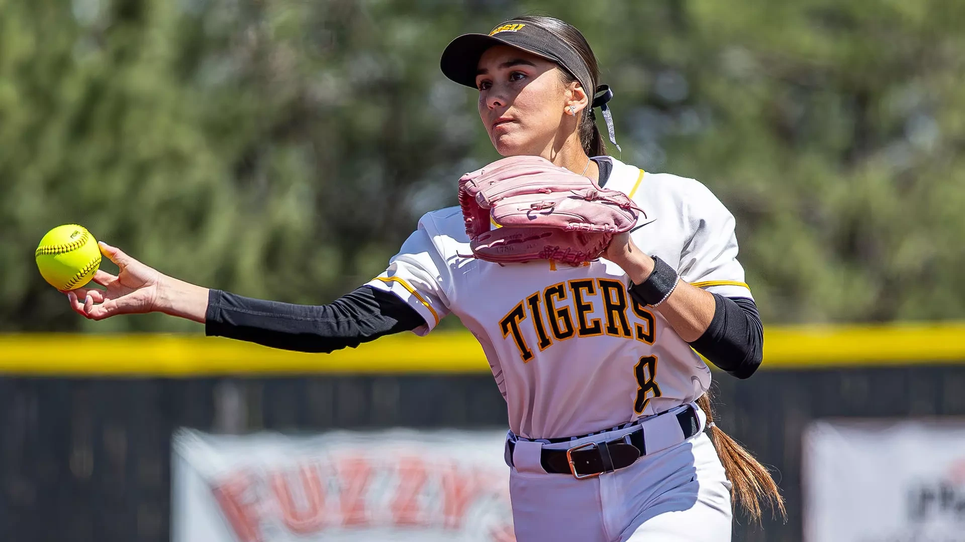 Lilliana Ramirez-Johnson throws a ball to first base during a contest against Newman