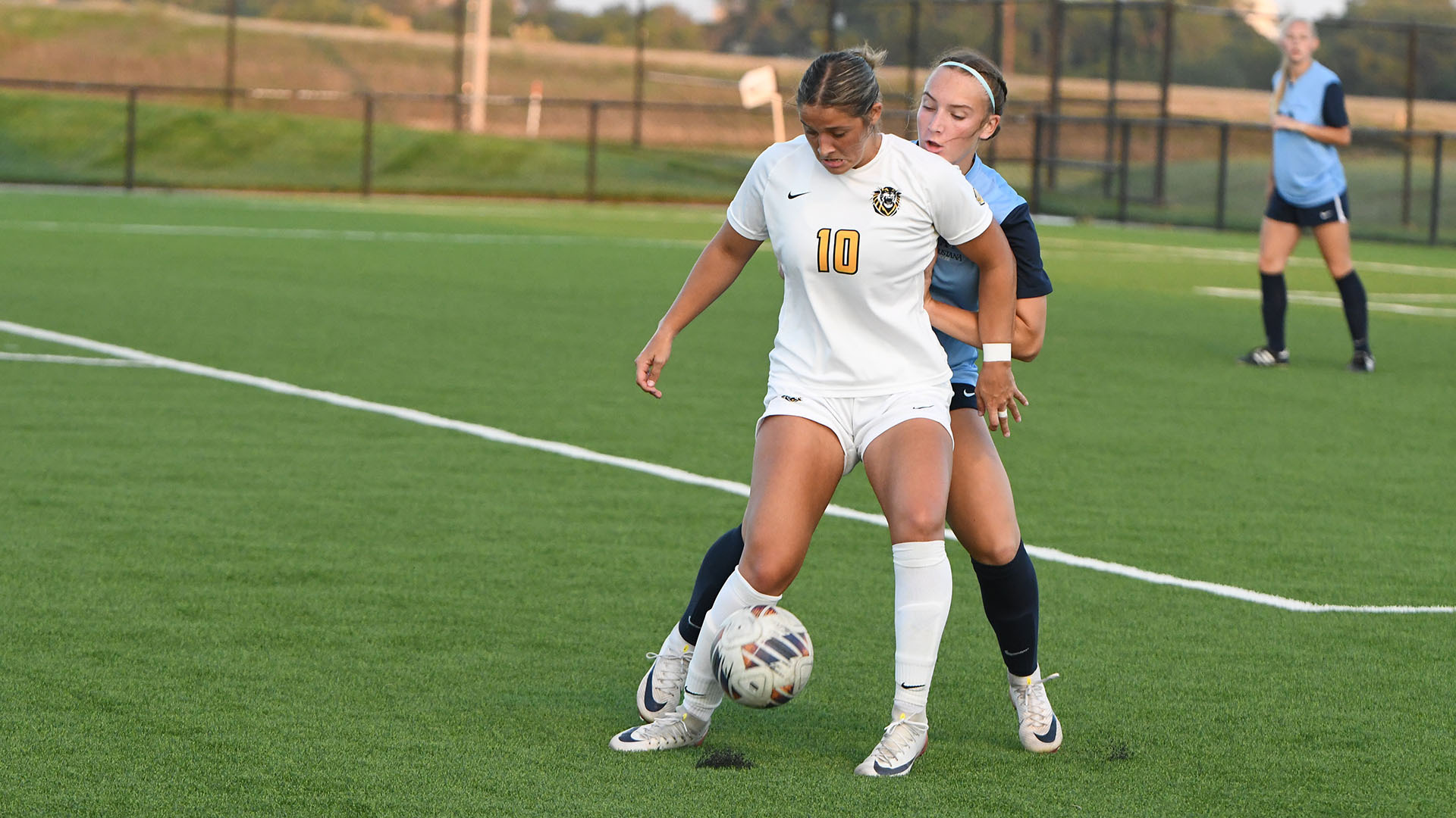 Payton Porter looks to steady a ball in a match against Augustana