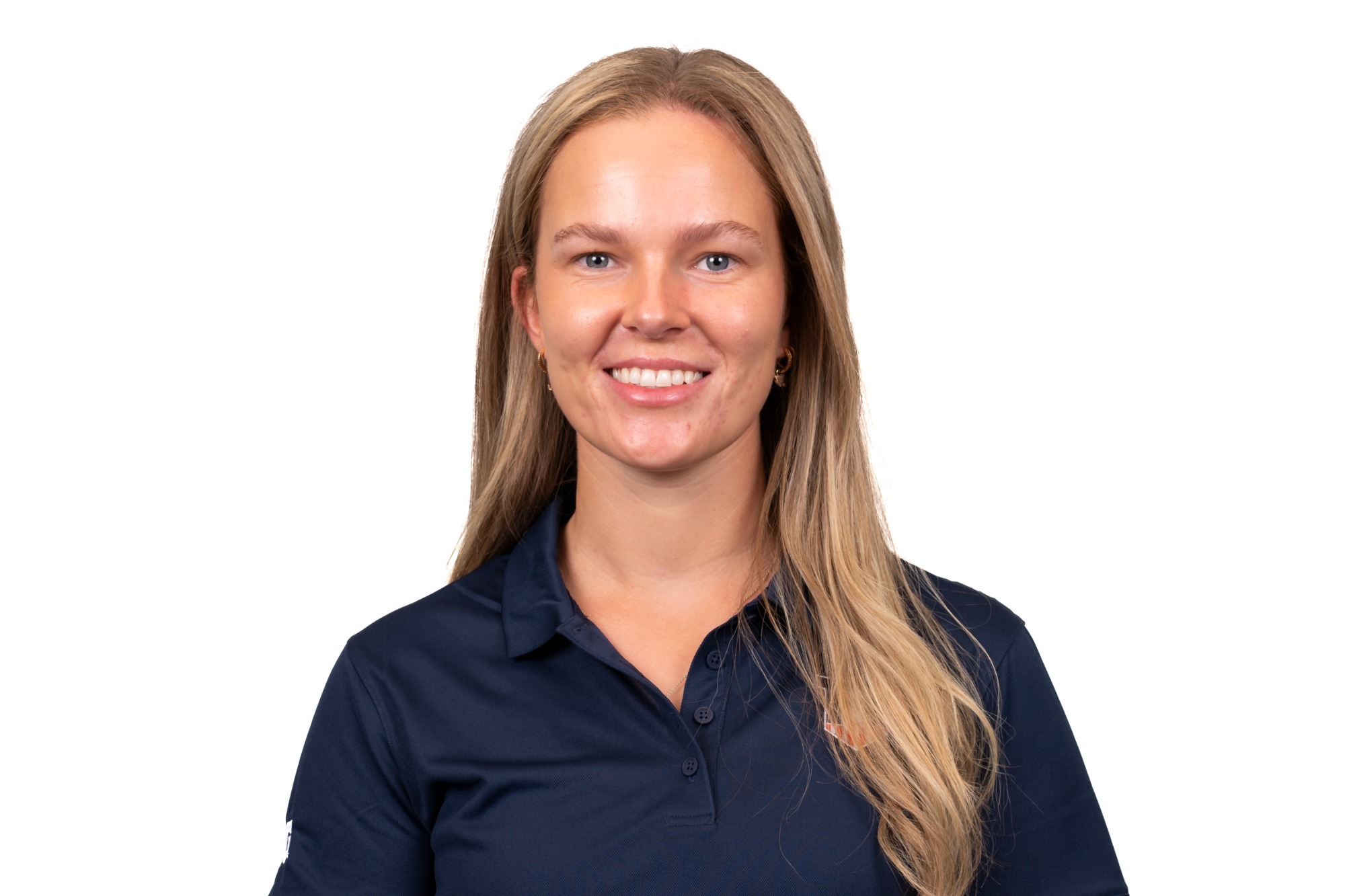 CHAMPAIGN, IL - August 20, 2023 - Illinois Assistant Coach Julie Hovland headshot taken during 2023 Olympic Sport Headshot Day in the Hall of Fame room of Bielfeldt Athletics Administration Building in Champaign, IL. Photo By Kevin Snyder