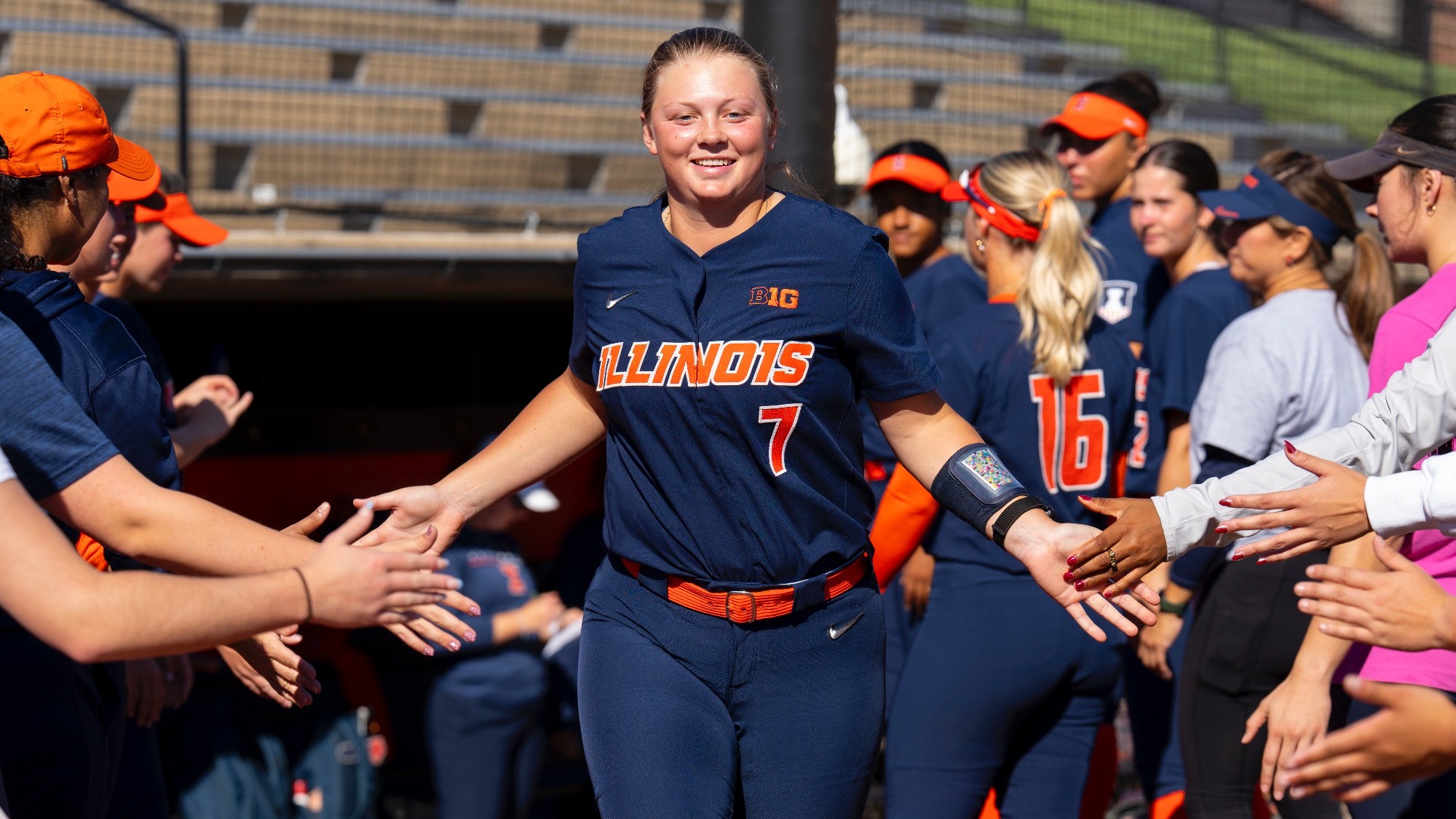 Ellie Haggard runs onto the field before an alumni game