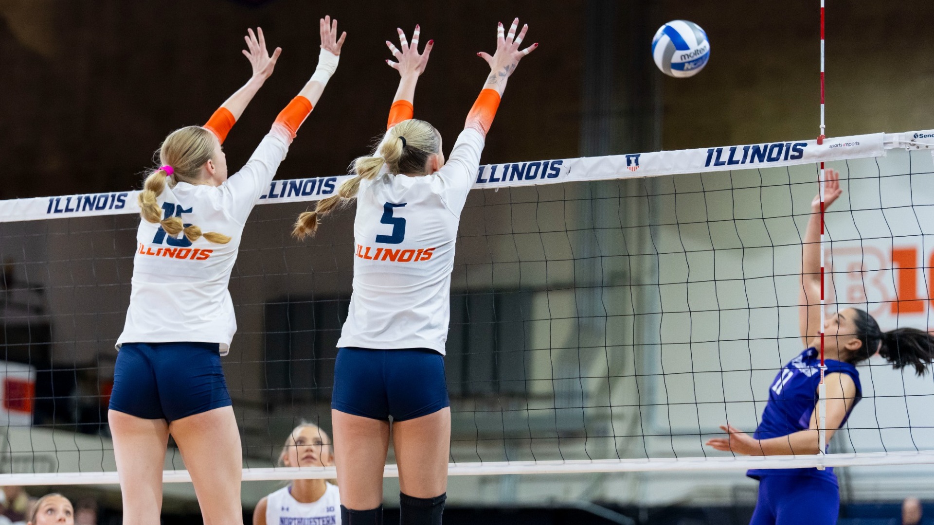 CHAMPAIGN, IL - November 26, 2025 - Middle Blocker Ashlyn Philpot (#16), Outside Hitter/Opposite Hitter Taylor de Boer (#5) during the match between the Indiana Hoosiers and the Illinois Fighting Illini at Huff Hall in Champaign, IL. Photo By Ashley Ray/Fighting Illini