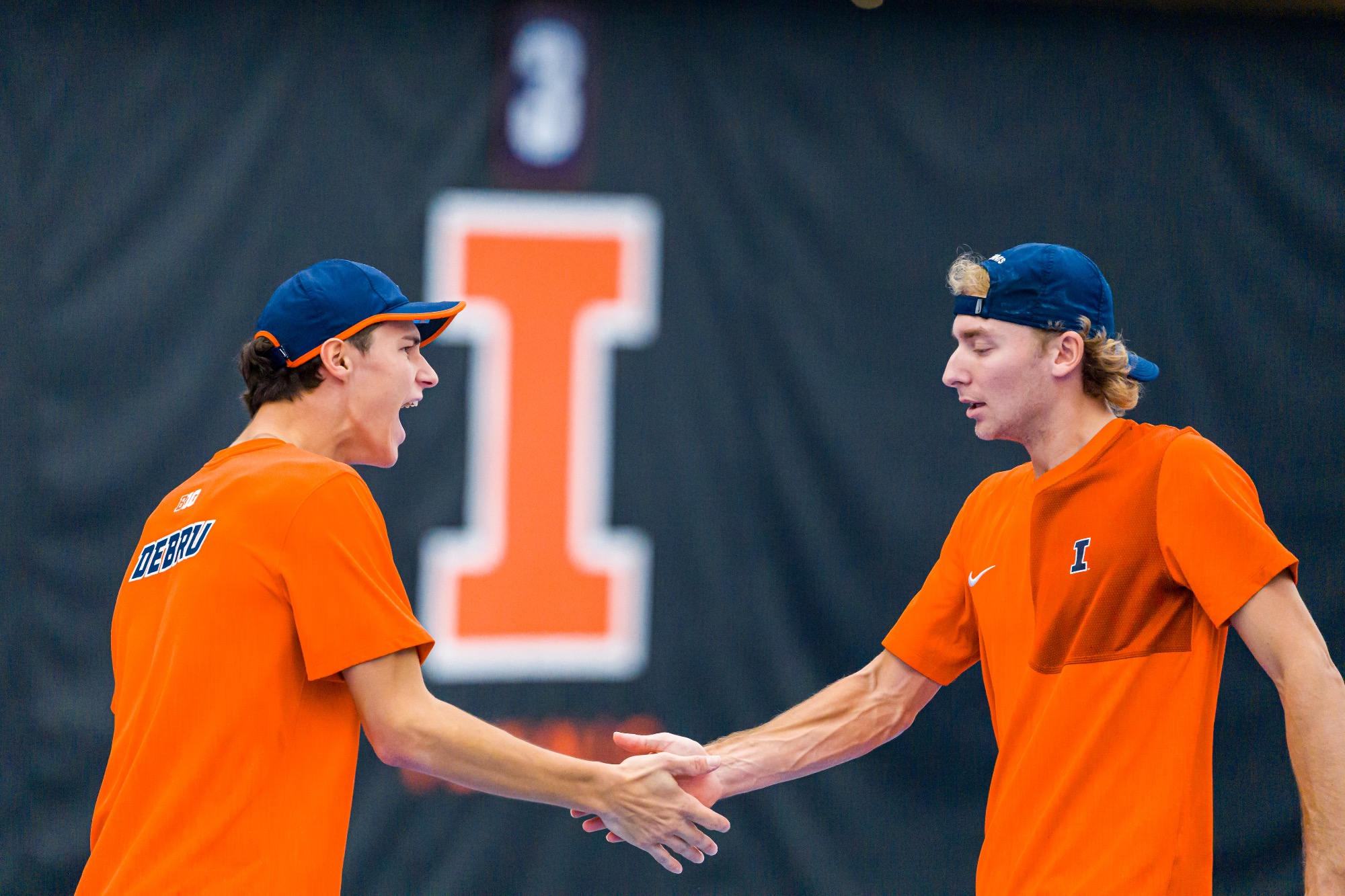 CHAMPAIGN, IL - February 22, 2026 - Gabriel Debru, Tyler Bowers during the match between the North Carolina Tar Heels and the Illinois Fighting Illini at Atkins Tennis Center in Champaign, IL. Photo By Lucas Sun