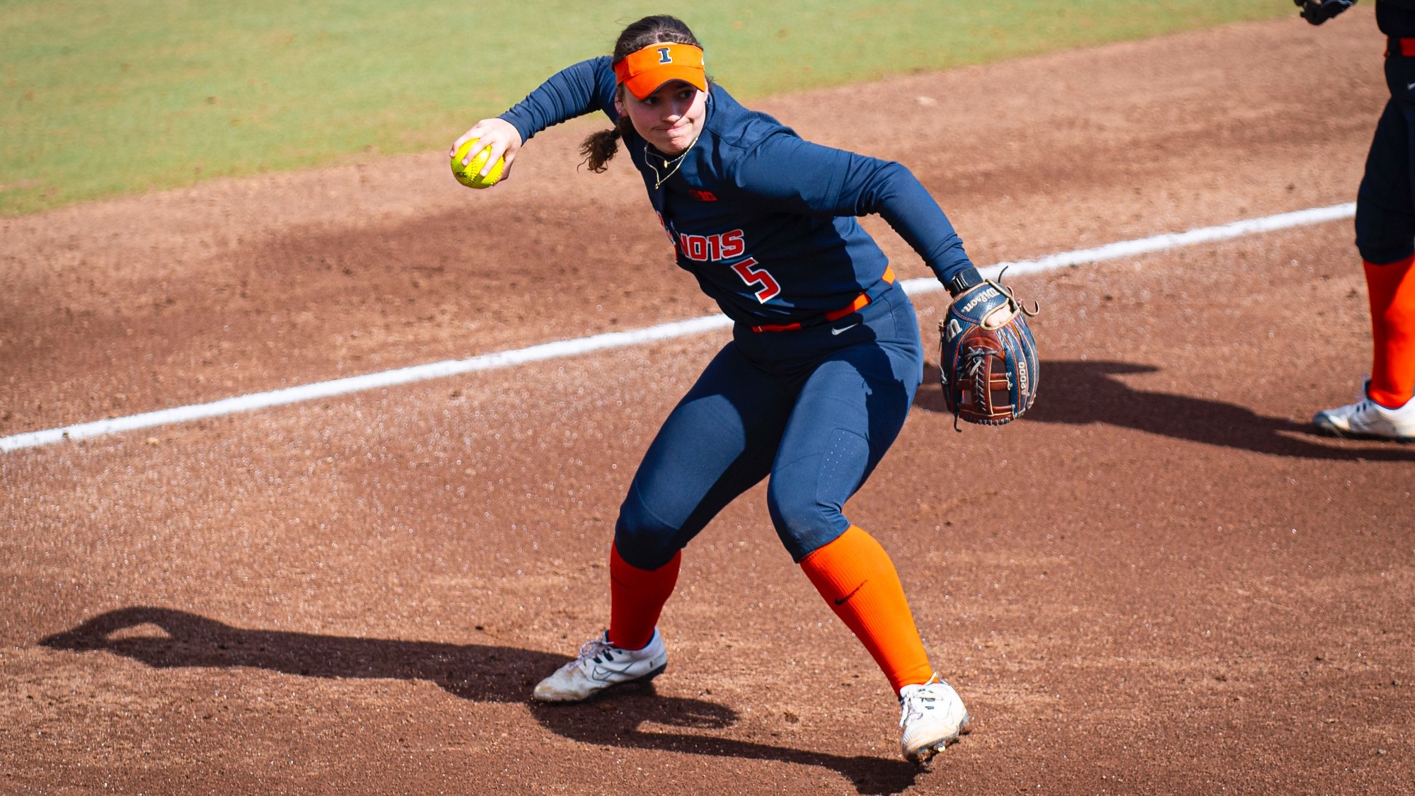 Adisyn Caryl throws a softball at Eichelberger Field