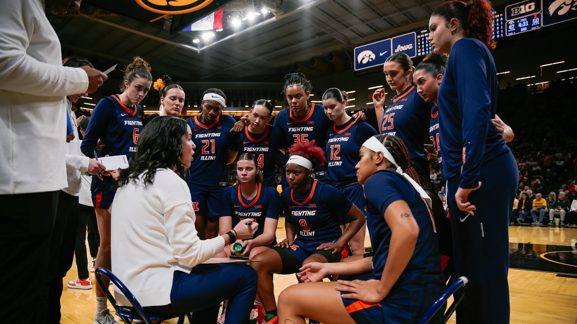 Team huddle at Iowa Shauna Green