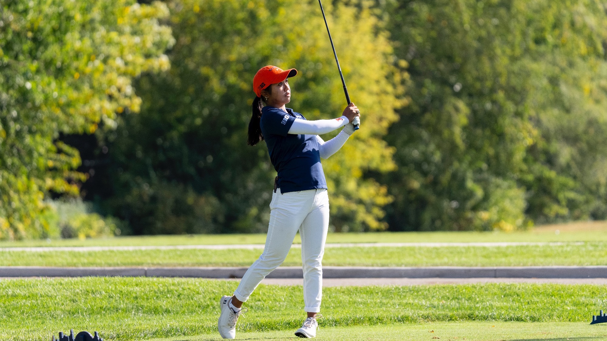 Brielle Mapanao watches the ball after swinging