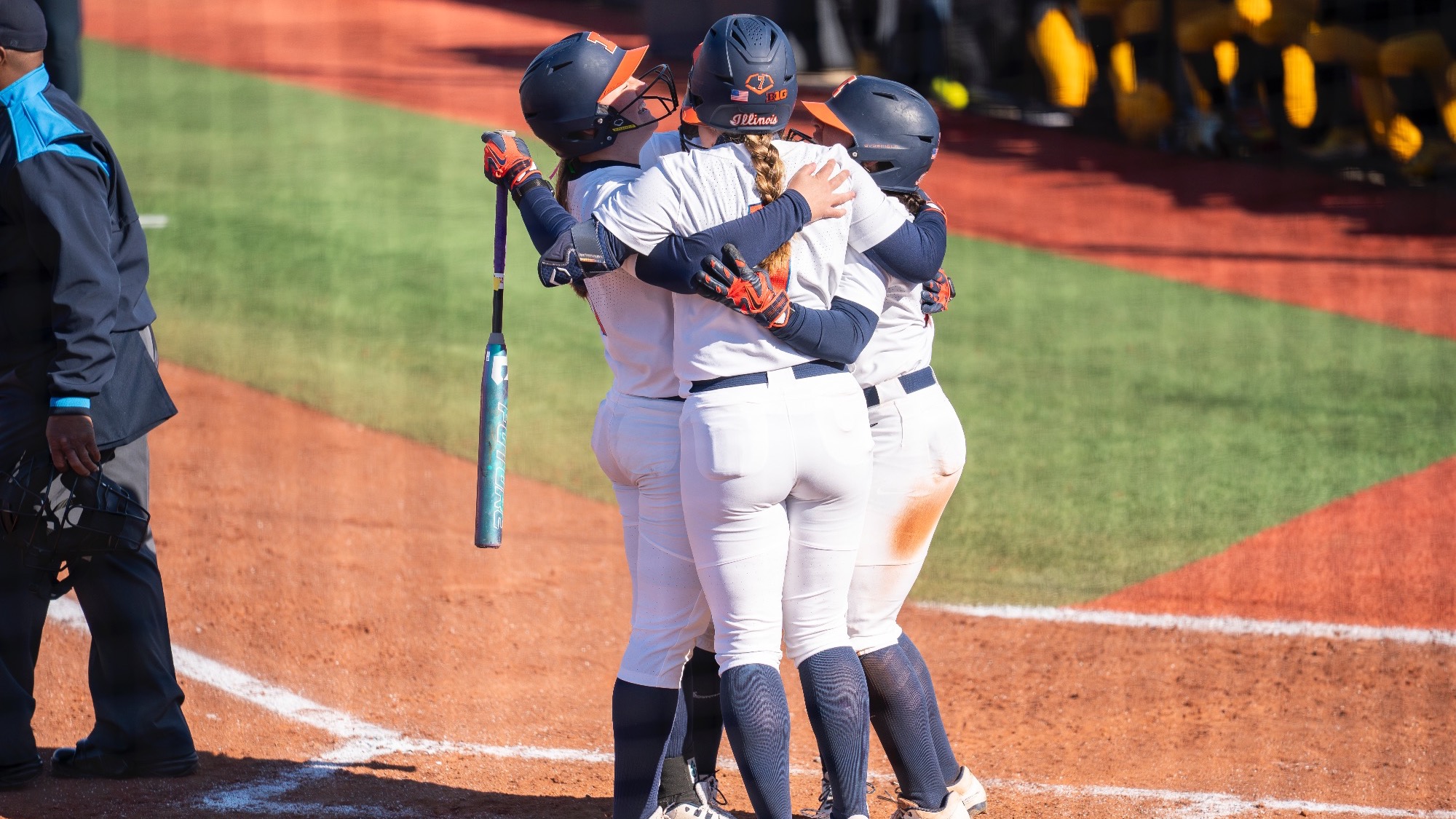 Eileen Donahue hugs teammate after scoring a home run