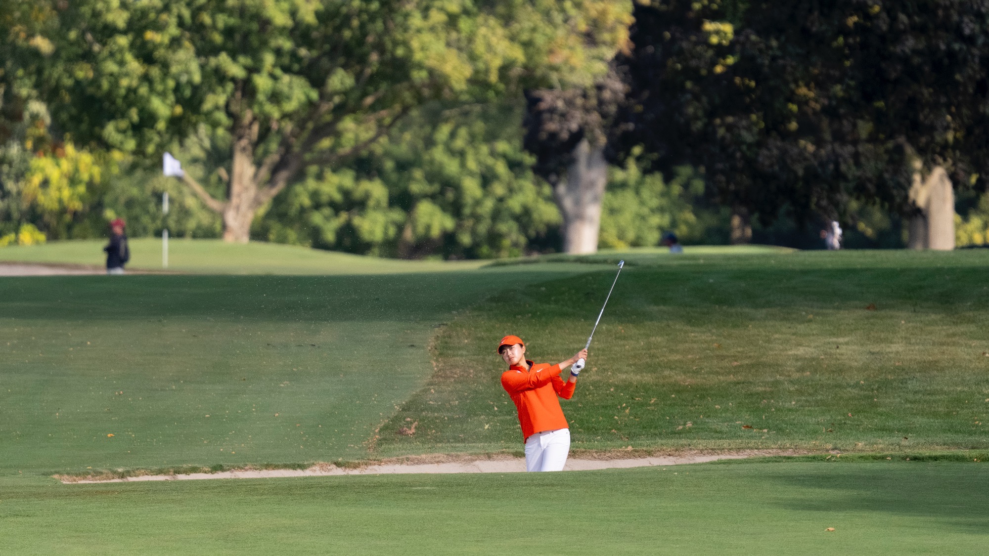 Victoria Zheng hits out of a bunker