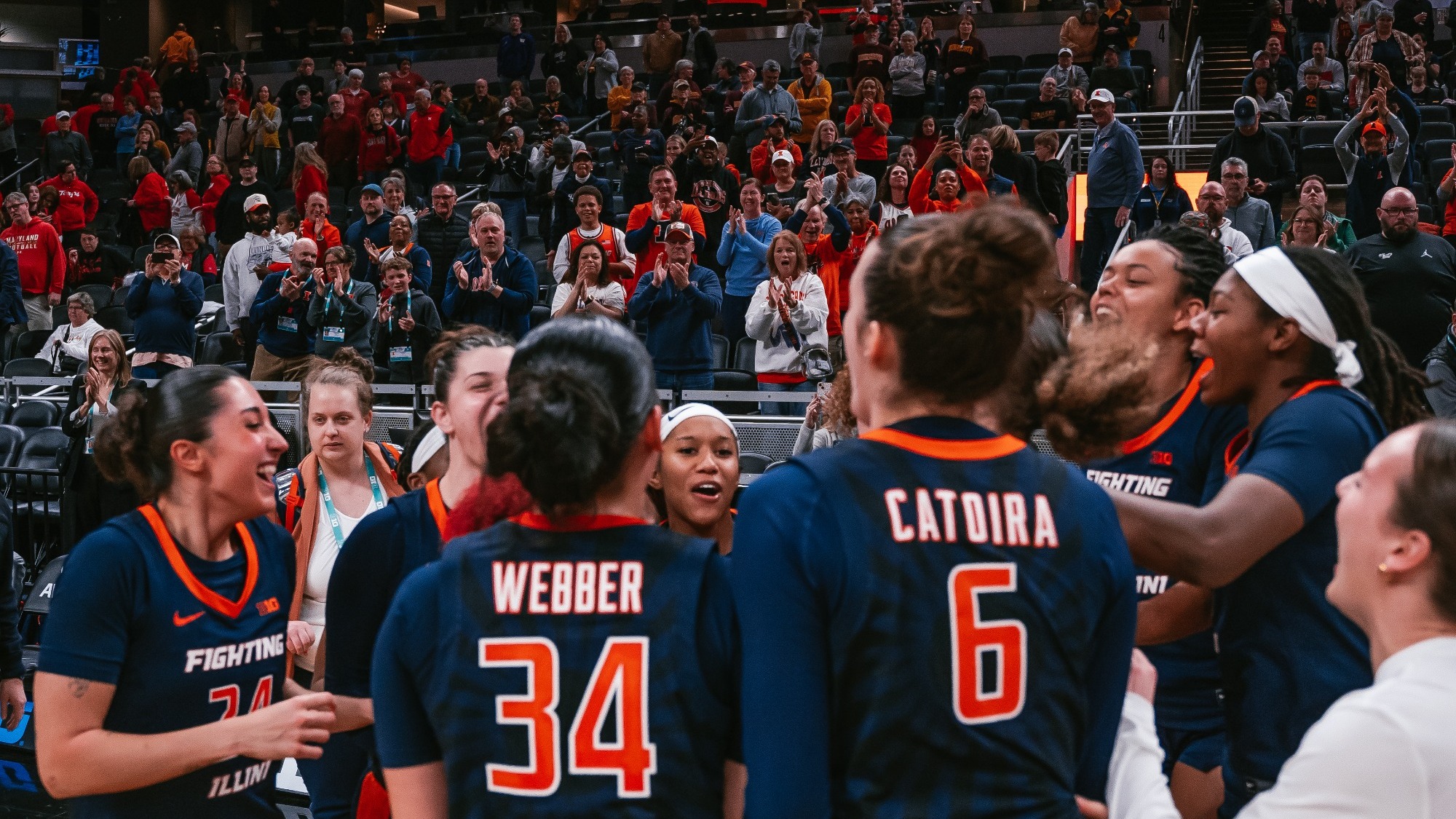 Team celebration in front of fans crowd at Big Ten Tournament