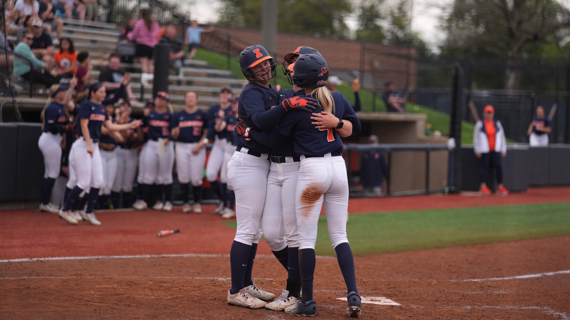 Illinois softball Eileen Donahue and Ellie Haggard hug after a home run.