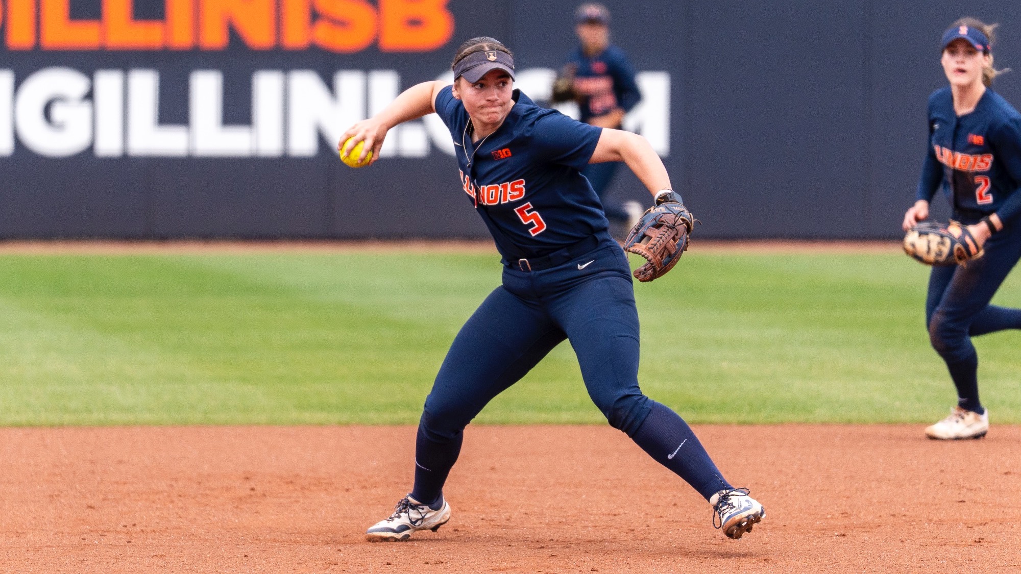 Adisyn Caryl throws softball at Eichelberger Field in Urbana, Illinois.
