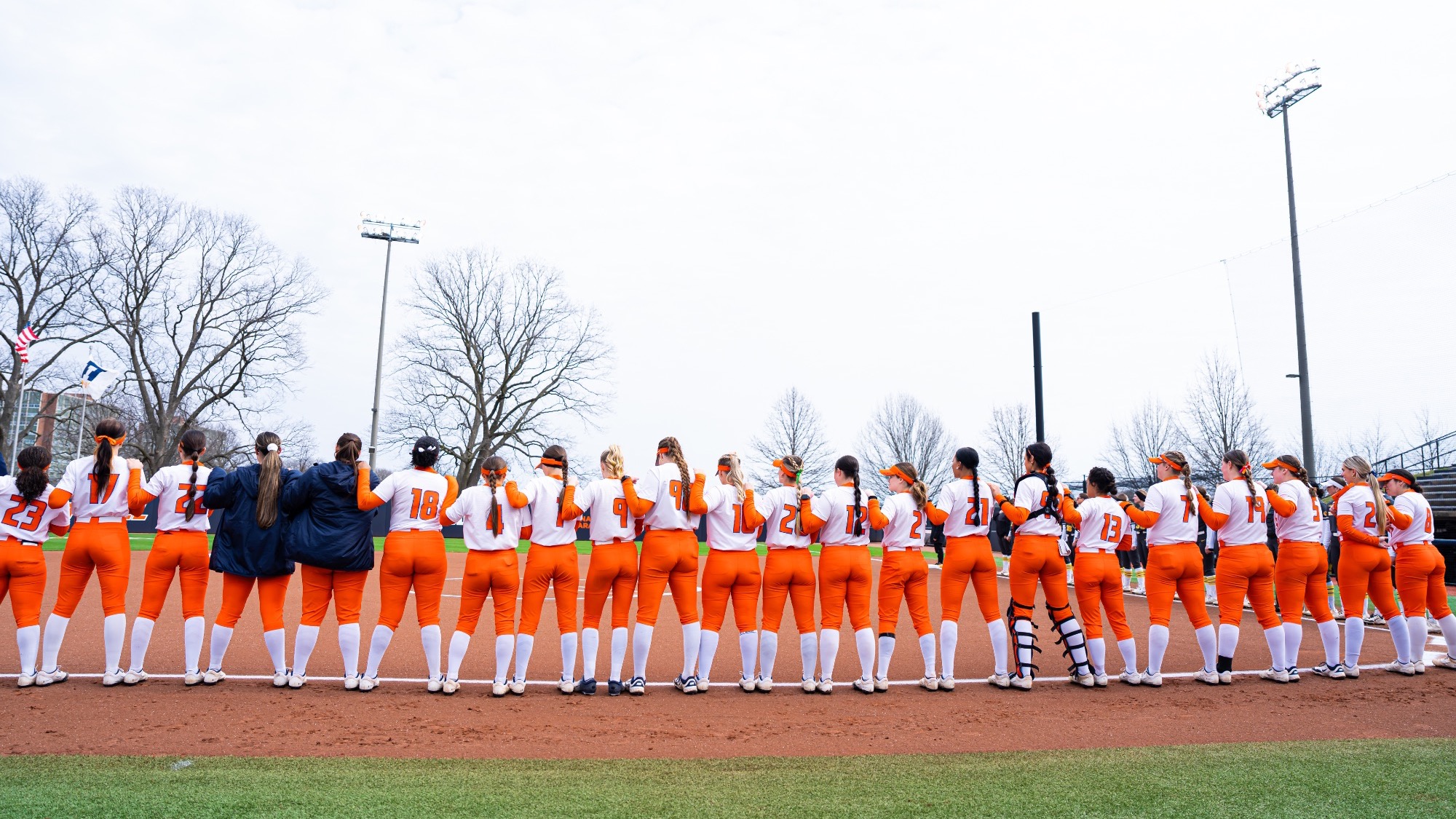 Illinois softball team lines up for the national anthem on Eichelberger Field in Urbana, Illinois.