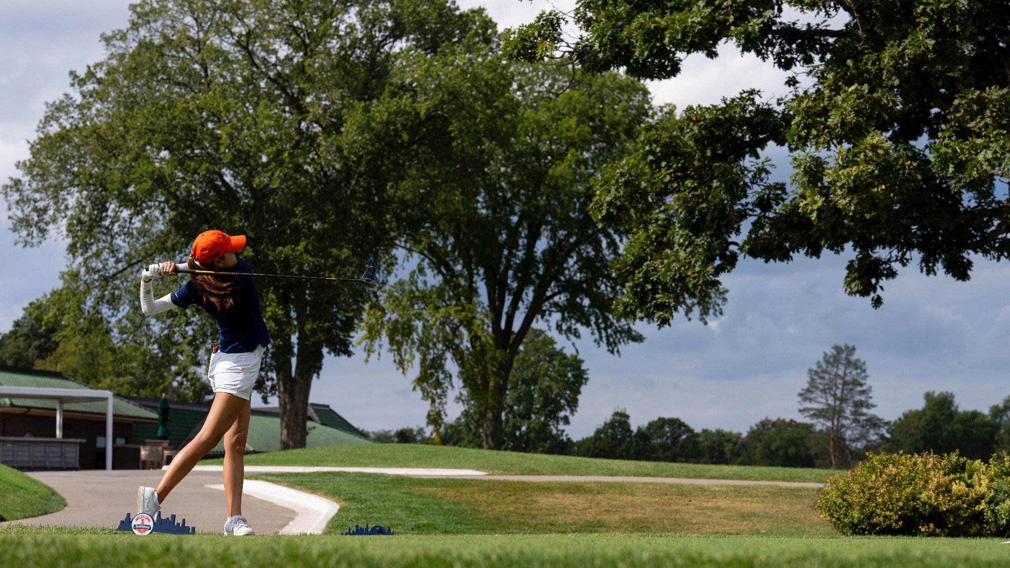 Erica Lee drives golf club at Medinah Country Club.