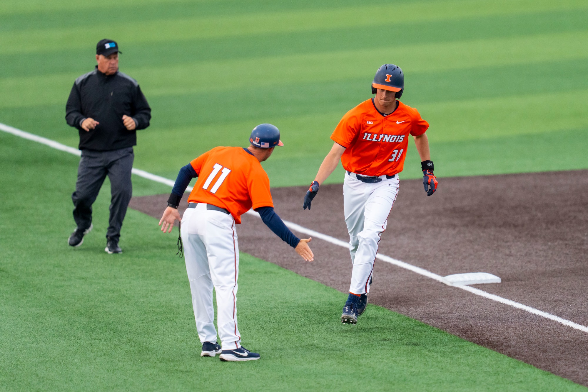 CHAMPAIGN, IL - April 28, 2026 - Assistant Coach Adam Christ, Outfielder Collin Jennings (#38) during the game between the Roosevelt University Lakers and the Illinois Fighting Illini at Illinois Field in Champaign, IL. Photo By Ashley Ray/Fighting Illini