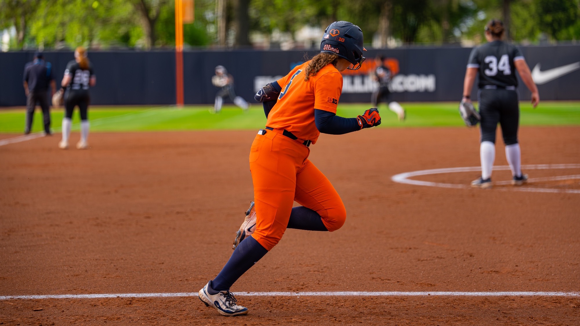 Adisyn Caryl runs to first base
