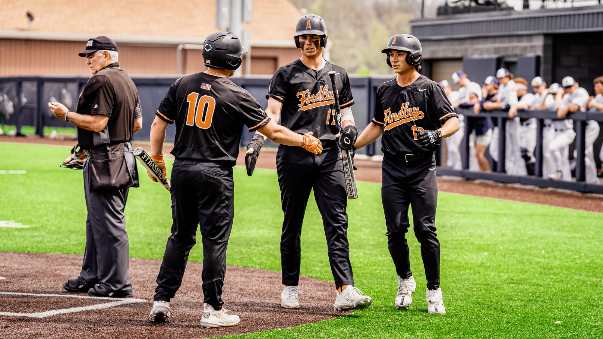 Casey Maruniak with teammates at Hillsdael