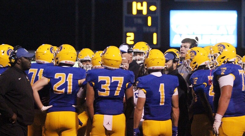 Findlay Football Team Huddled