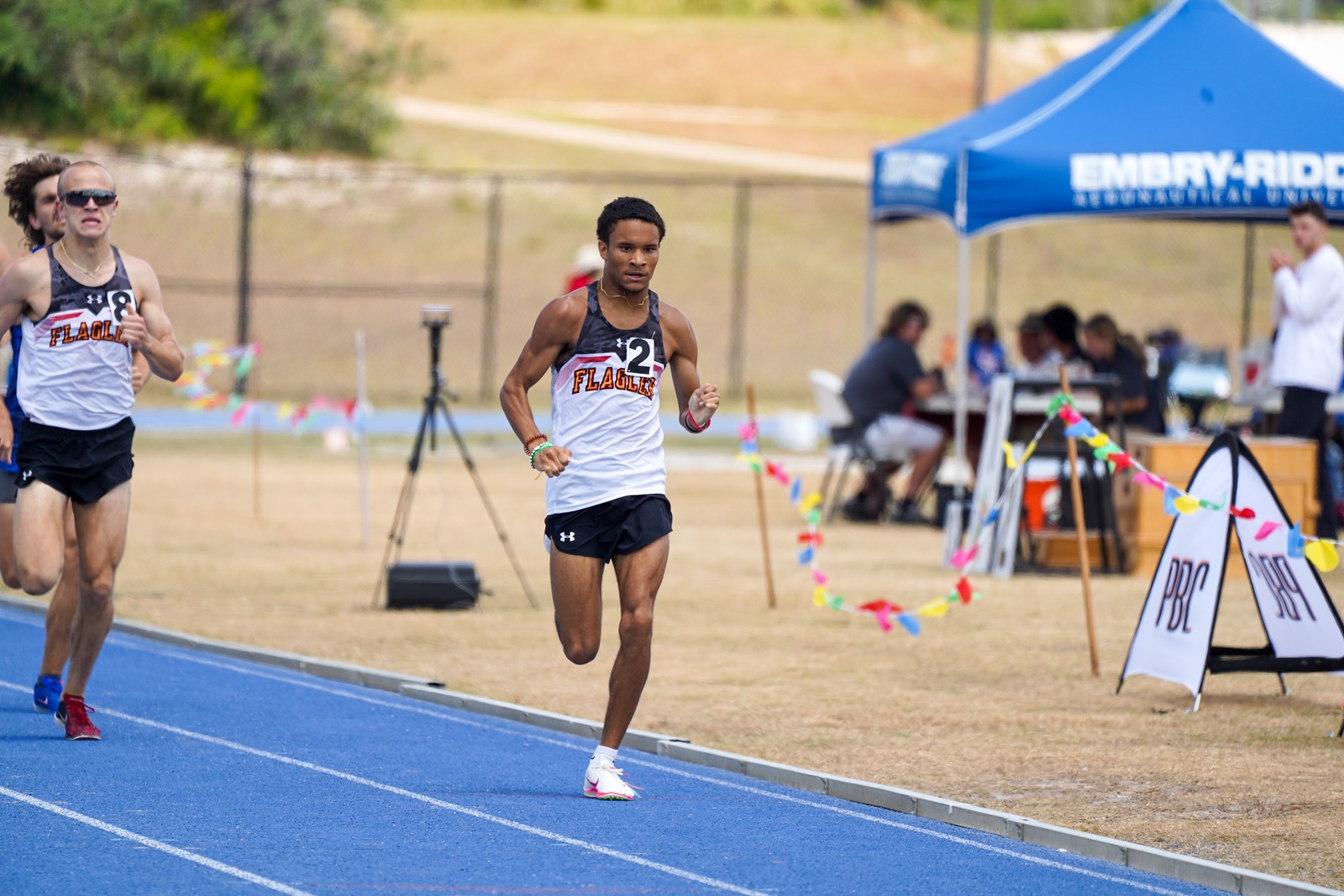 Kaleb Hollins finishing a race at the PBC Outdoor Championship. 