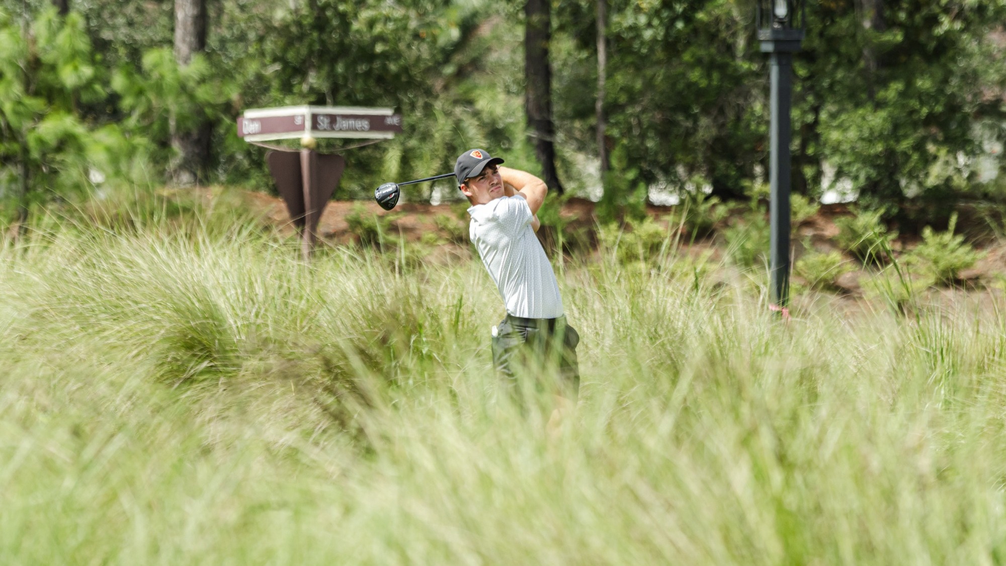 Nic Eberhard finishes his swing on the tee box