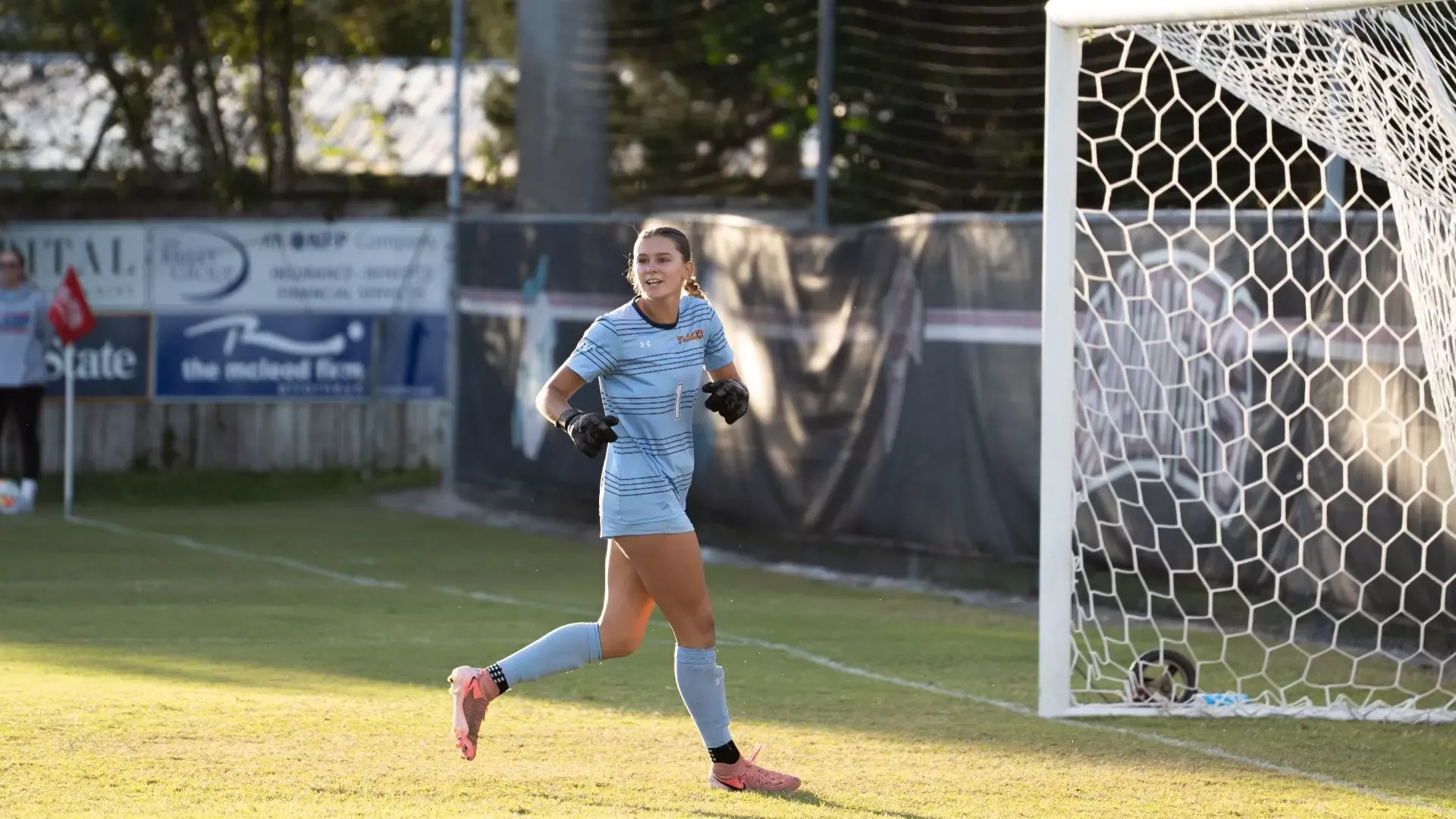 Phoebe Carpenter scrambles back to the goal