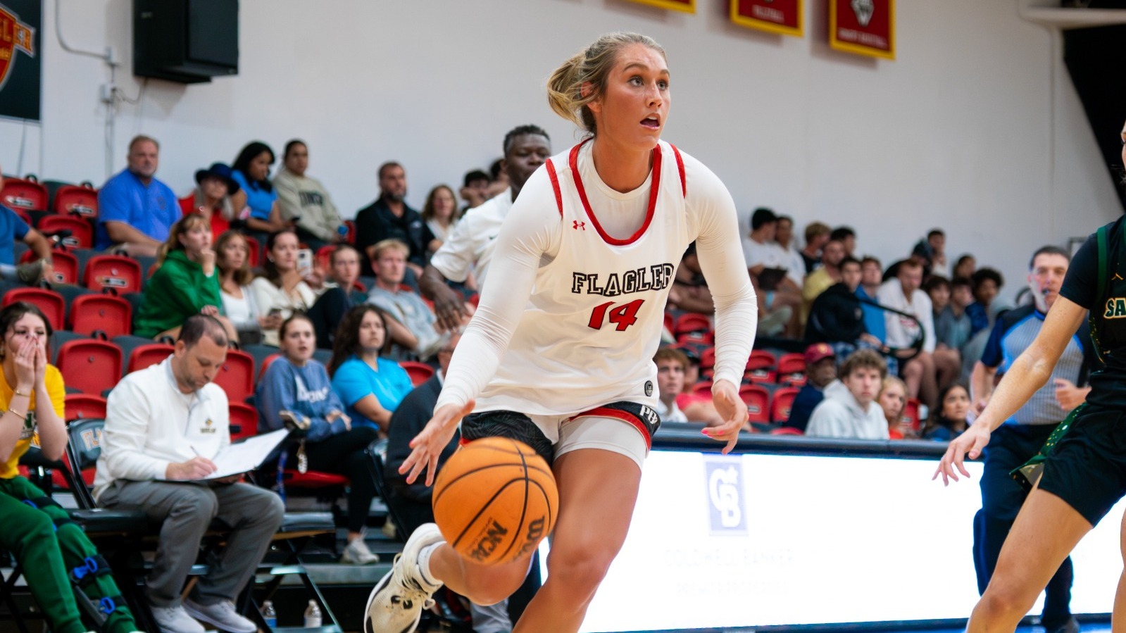 Marley Smith dribbles toward the hoop