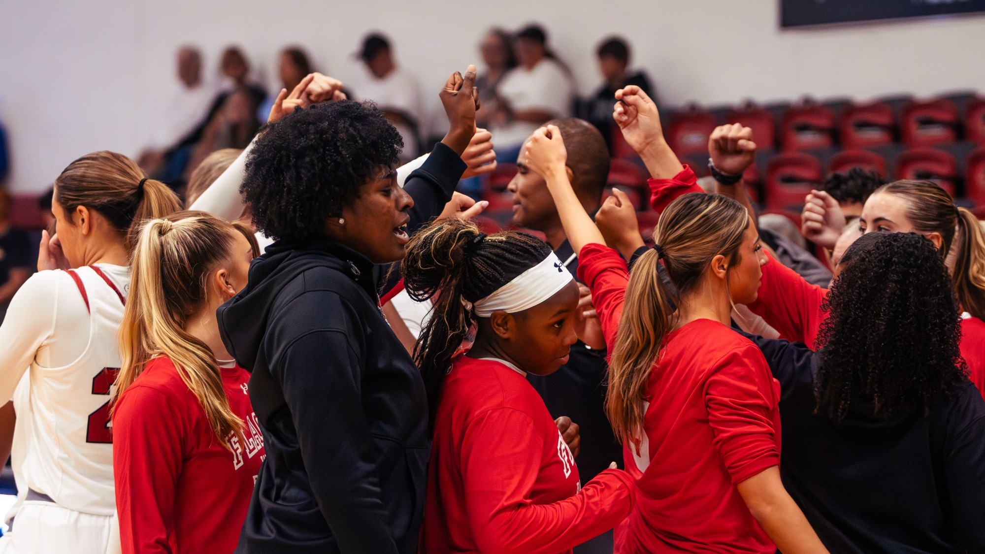 Women's basketball breaking the huddle after a timeout