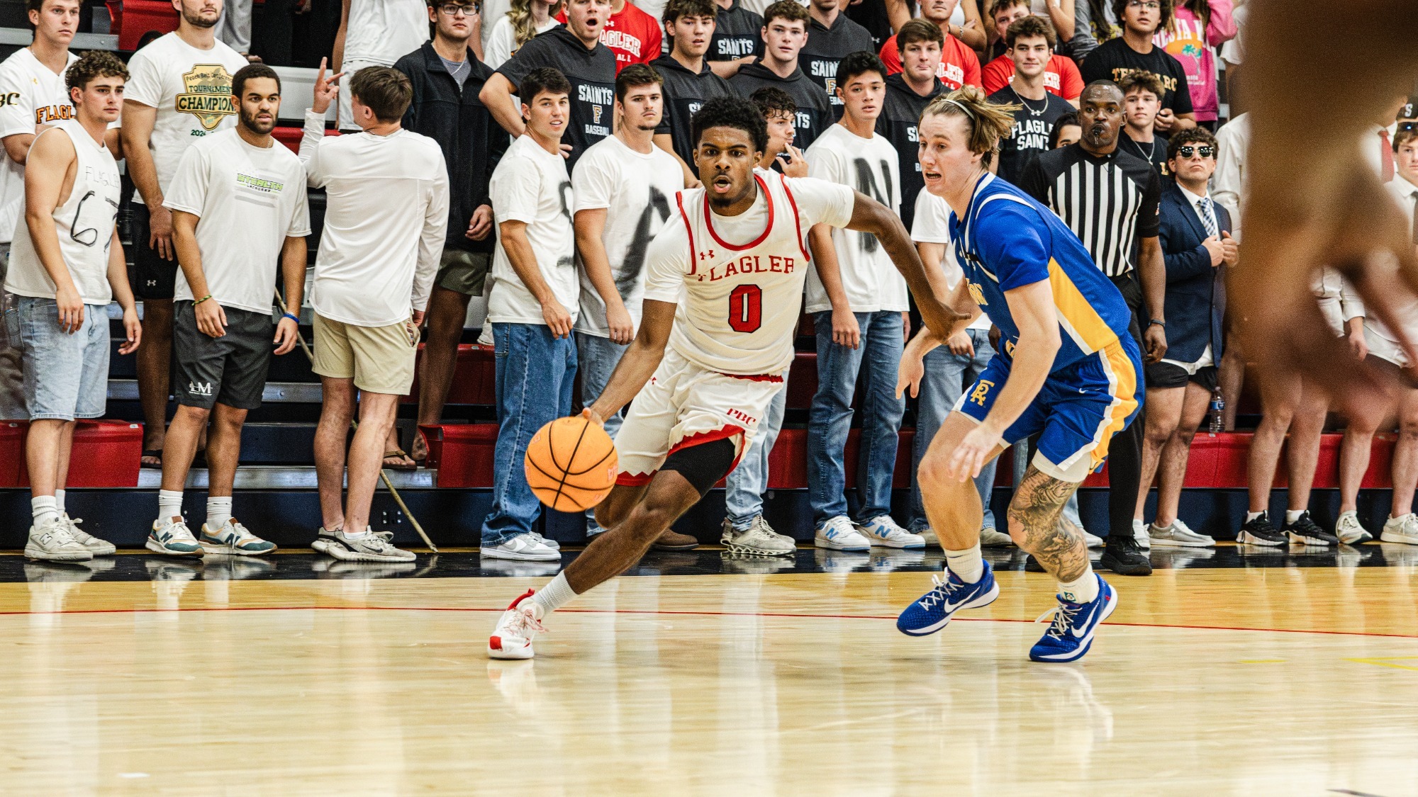 Camden Andrew dribbles by a defender