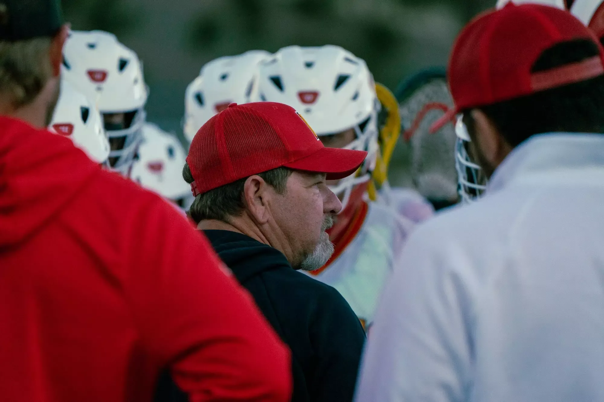 Brian Duncan talking in a huddle, close up