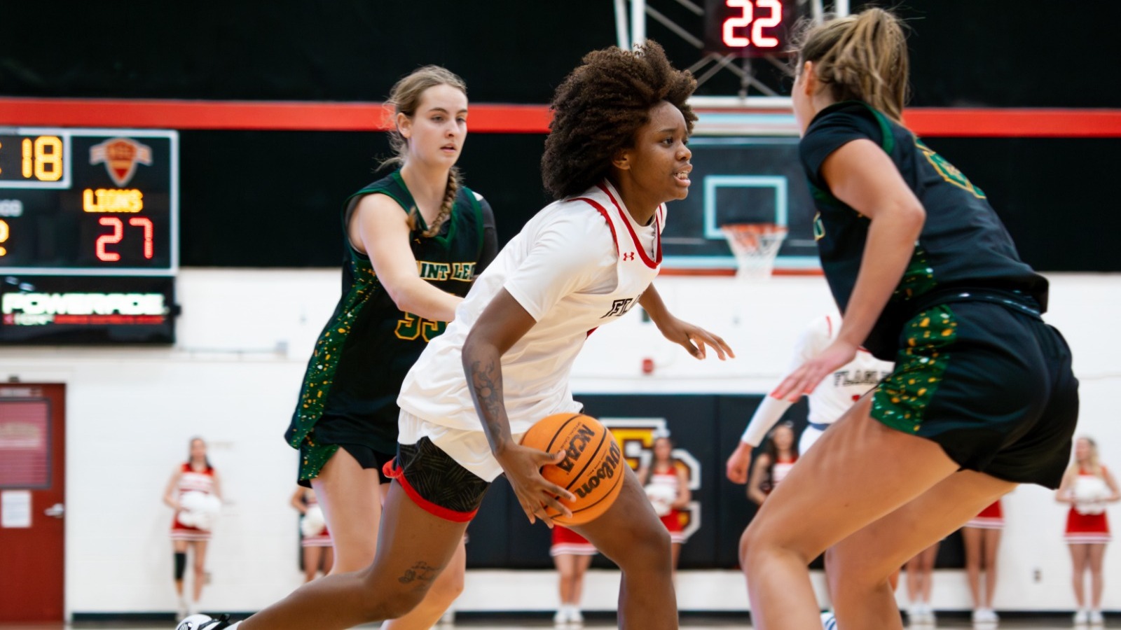 Gabby Bush dribbles towards the basket