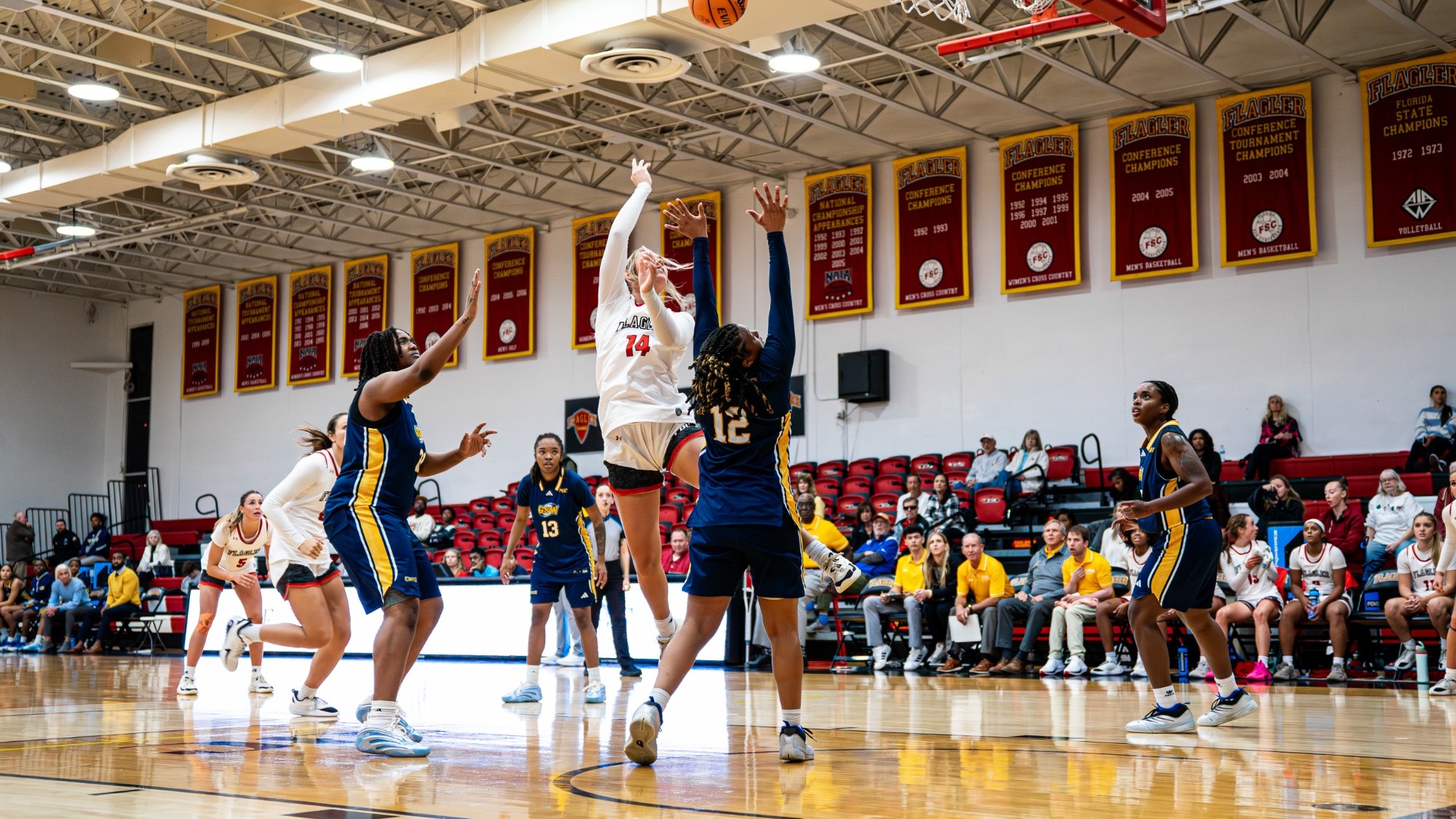 Marley Smith puts up a shot in the lane with defenders around