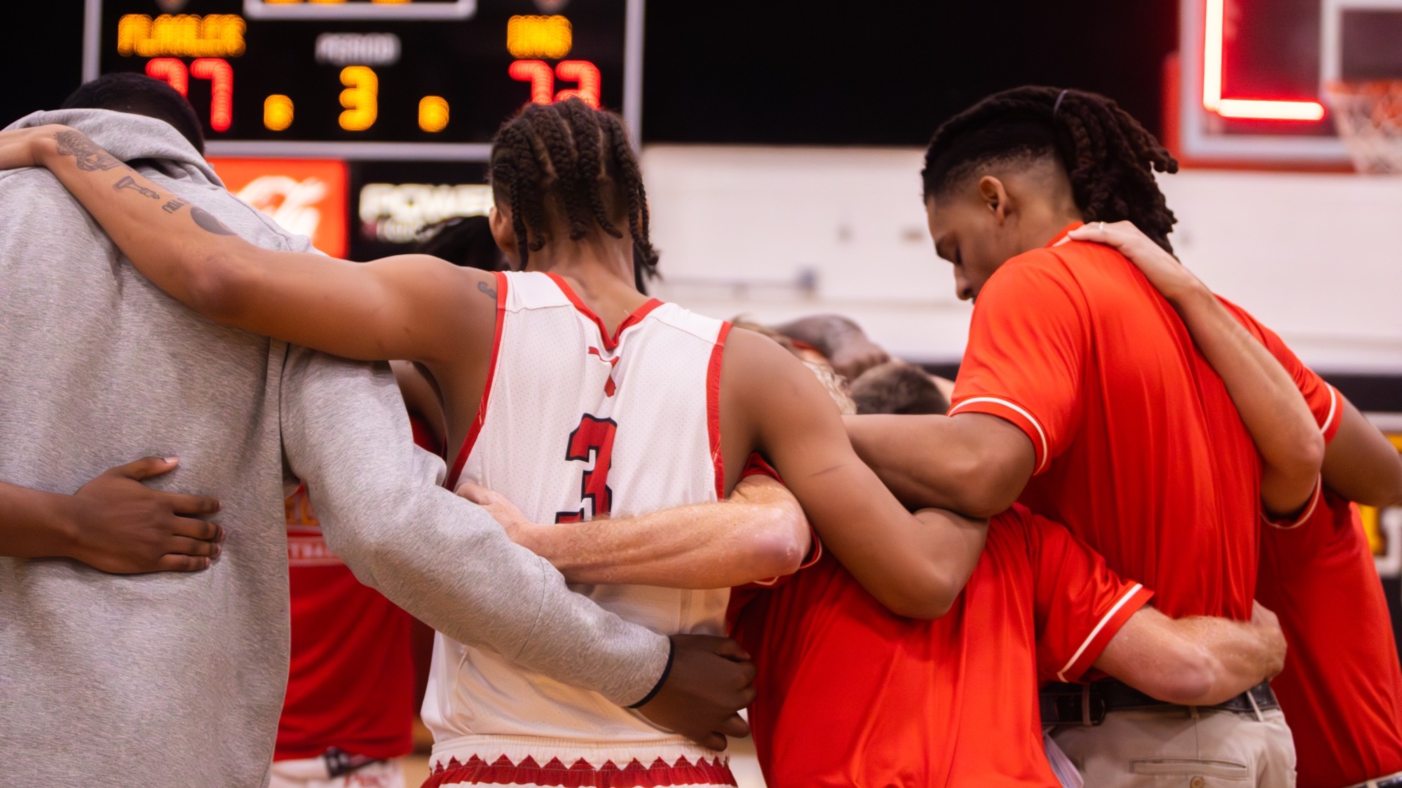 Men's basketball at center court after a game