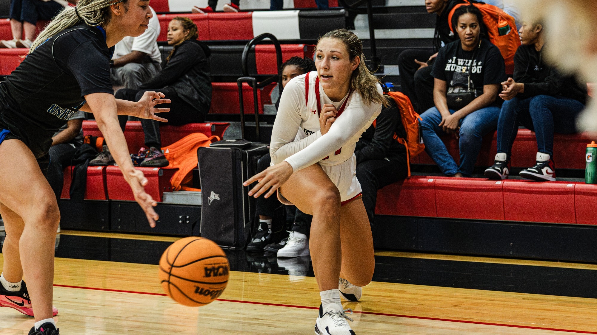 Carleigh Grimm bounces a pass past a defender.