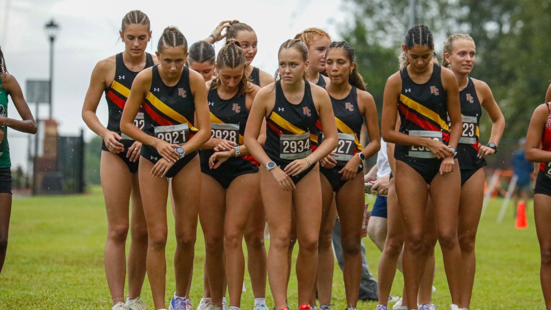 Women's XC team huddling together