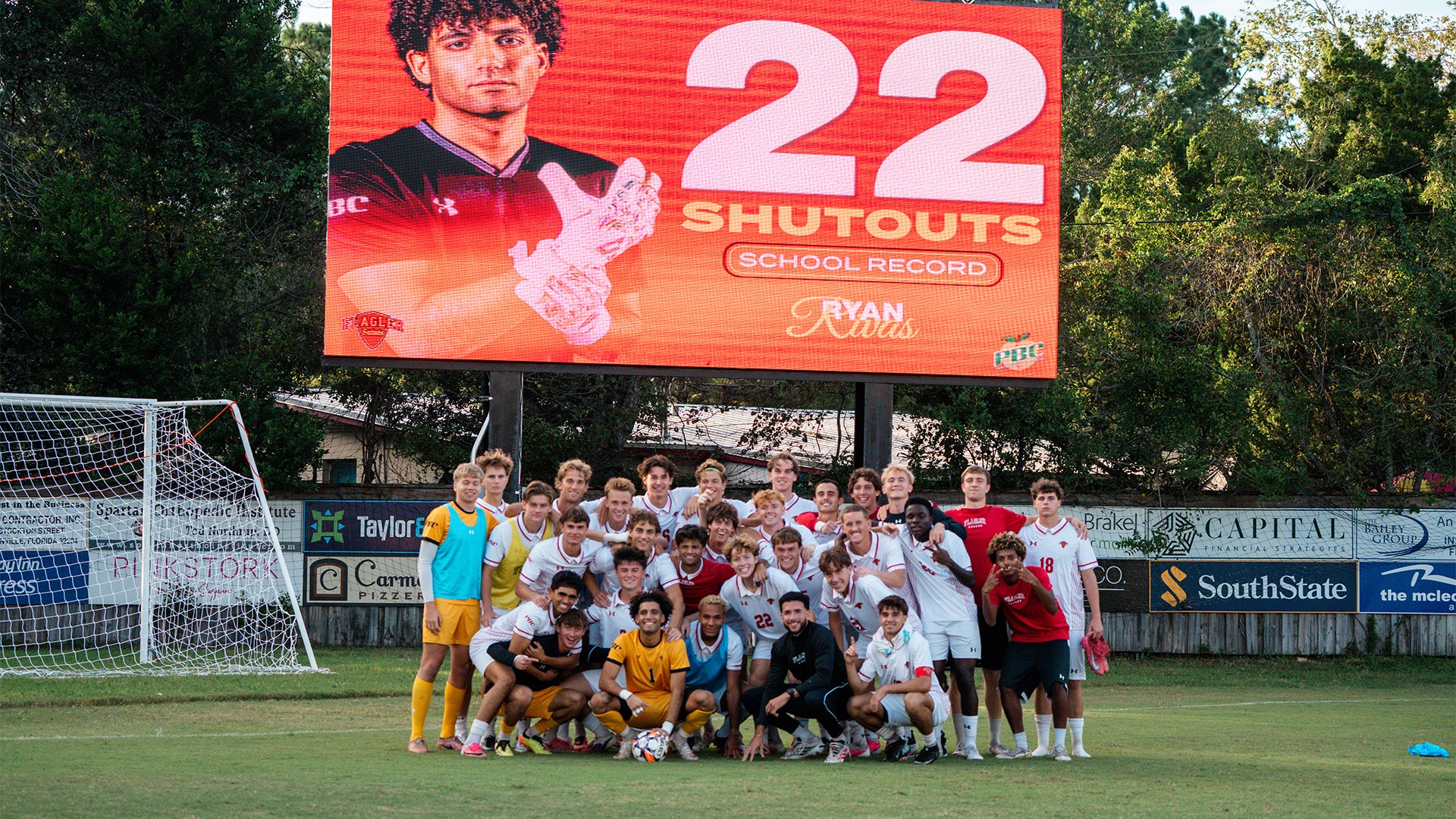 Team photo in front of the videoboard after Ryan Rivas broke the school record