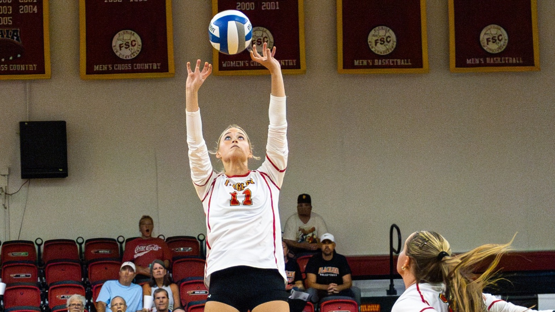 Jilly Young setting the volleyball for Gracie Fleming
