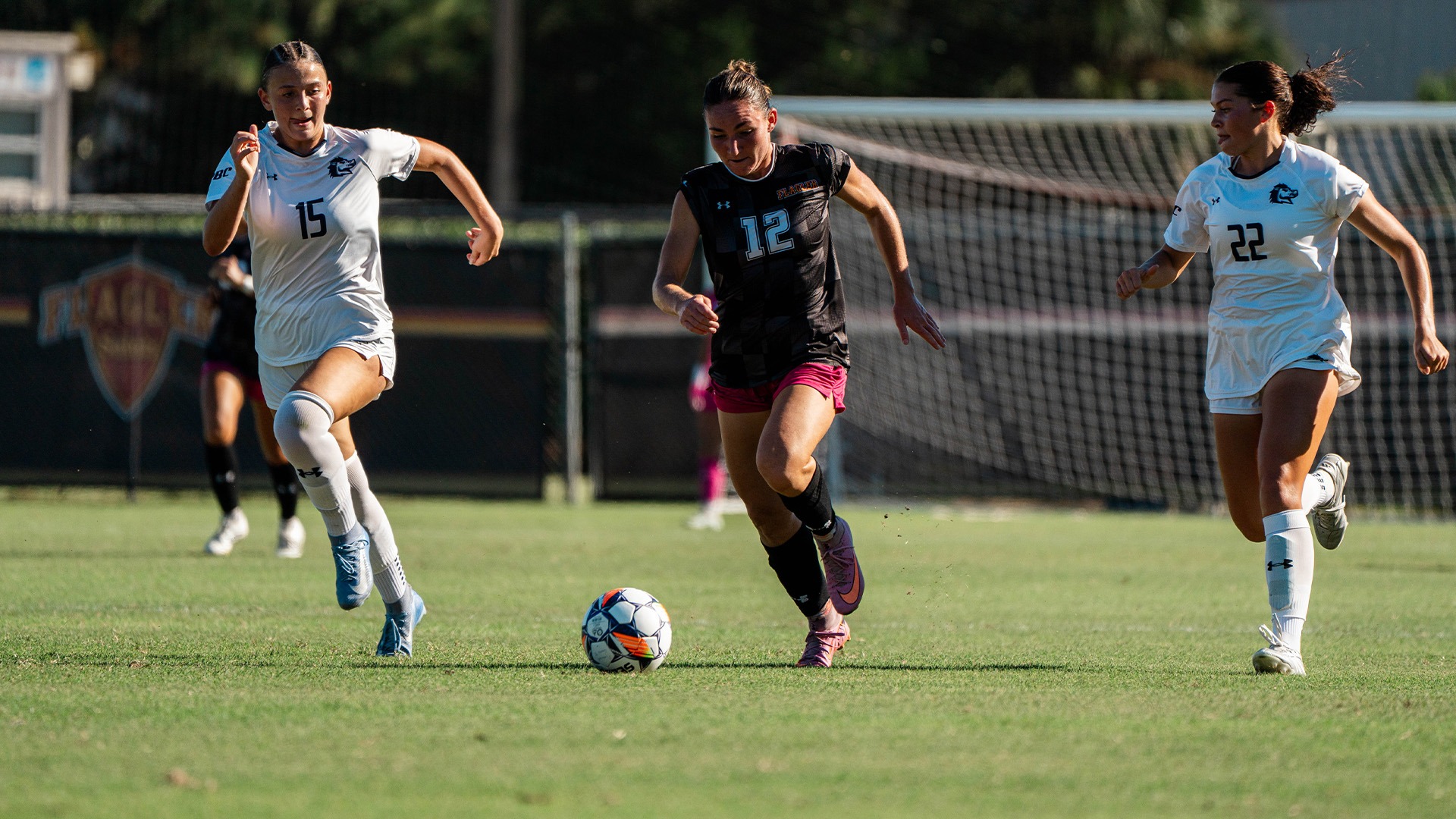 Anastasia Whitehouse dribbling against USCA
