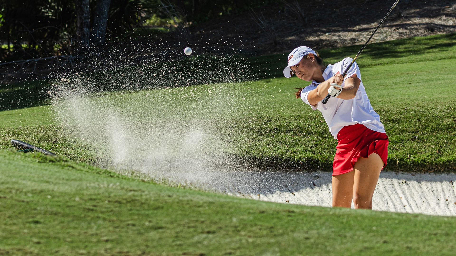 Kalia Polete chip shot out of the bunker at practice