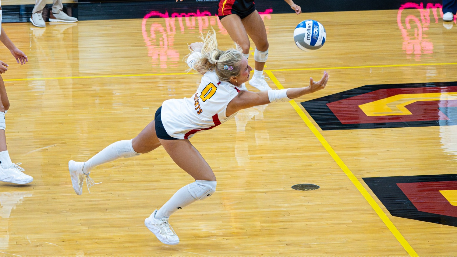 Amelia Fitzpatrick making a dive to dig the attack