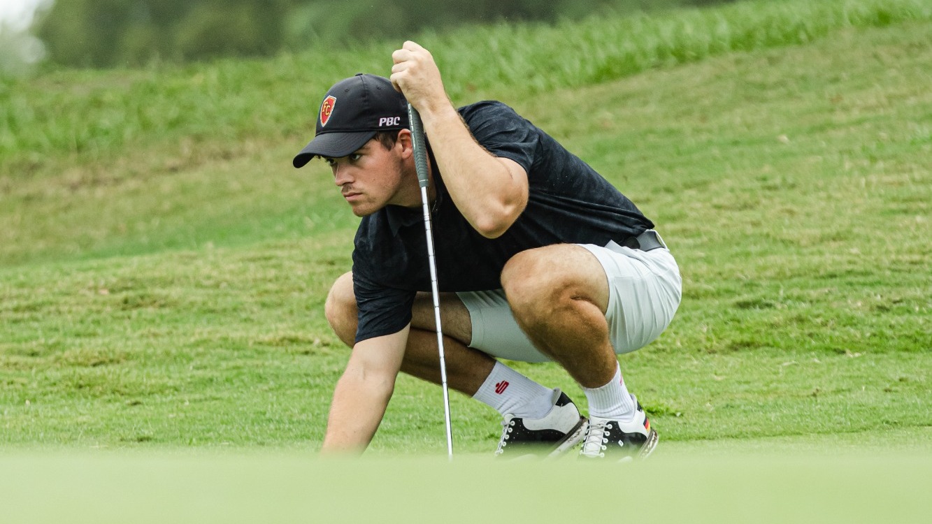 Nic Eberhard lines up his putt