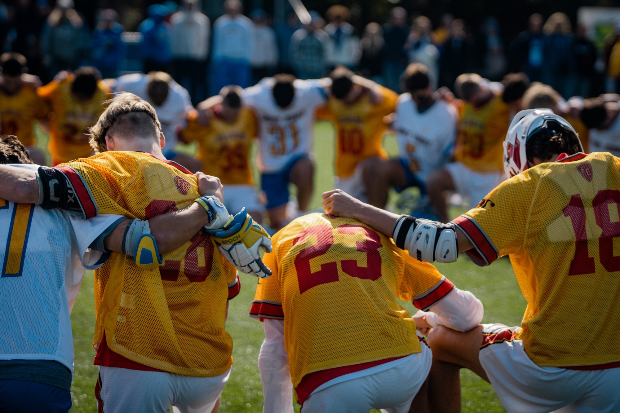 Team kneeling for a prayer