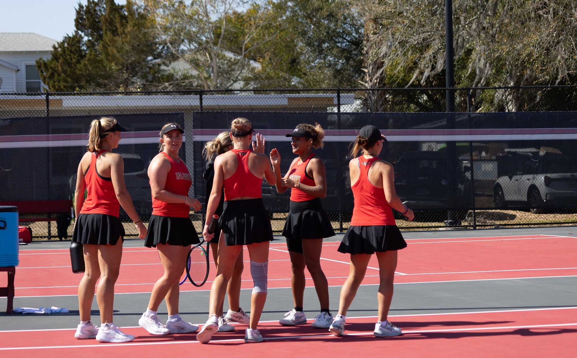 Team greeting each other after a win