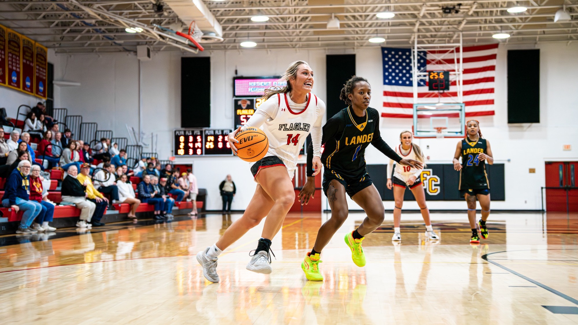 Marley Smith drives to the basket with a defender on her hip