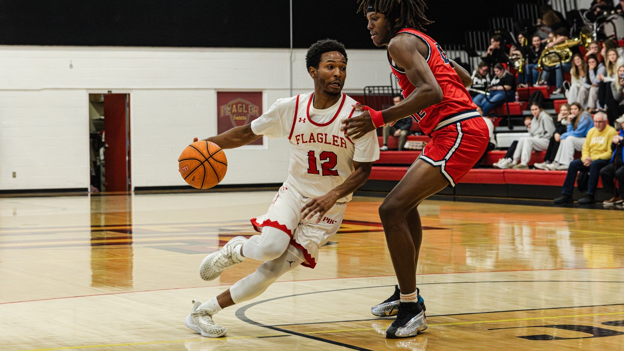 Rahdir Hicks drives the lane with a defender on him